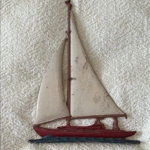 Metal sail boat with lots of patina many flaws 
Weathered cute